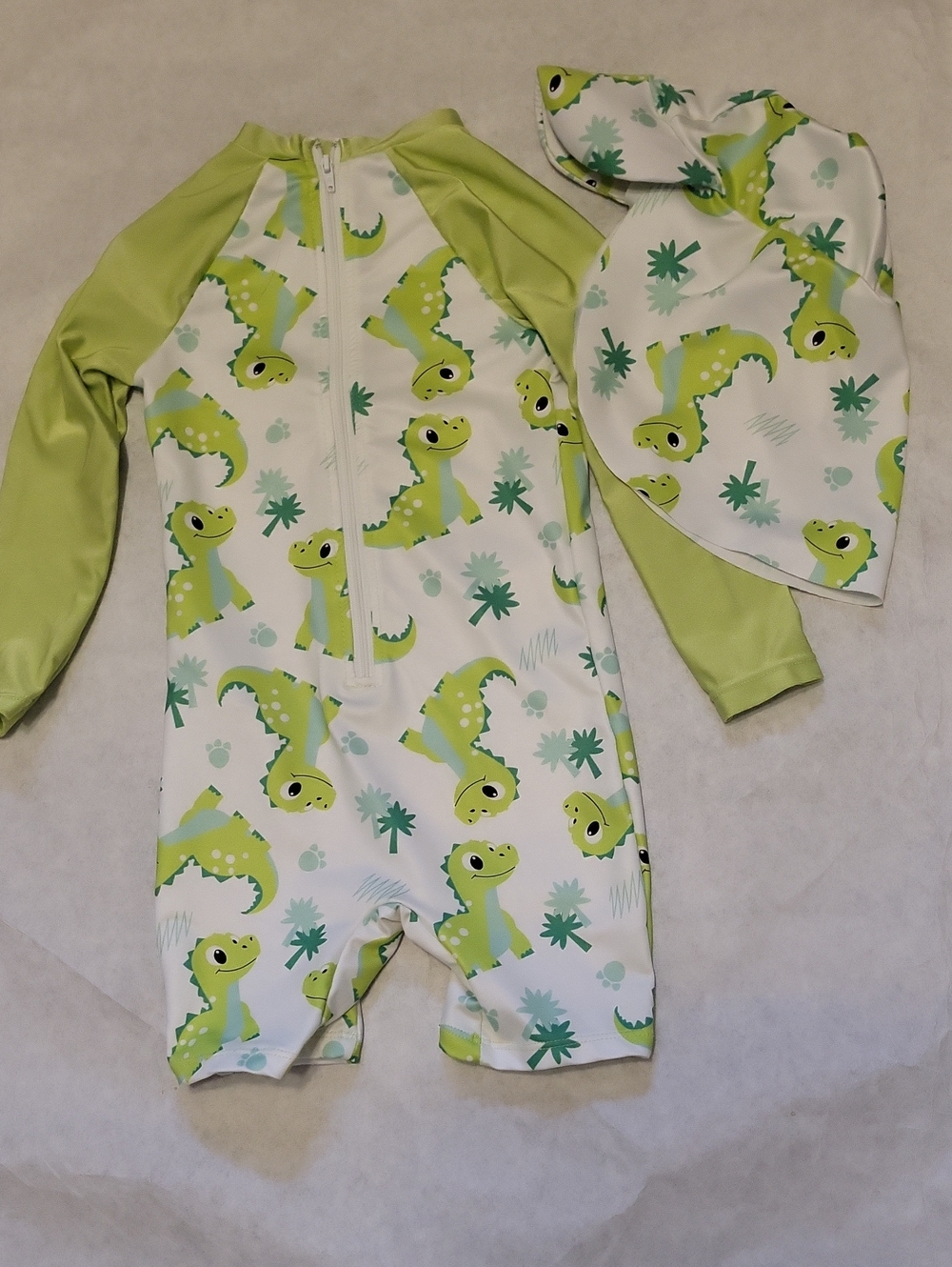 Rashguard dino print swimsuit with matching sun hat